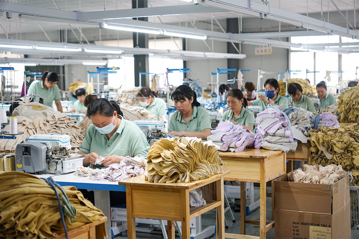 Main production floor with organic fabric rolls